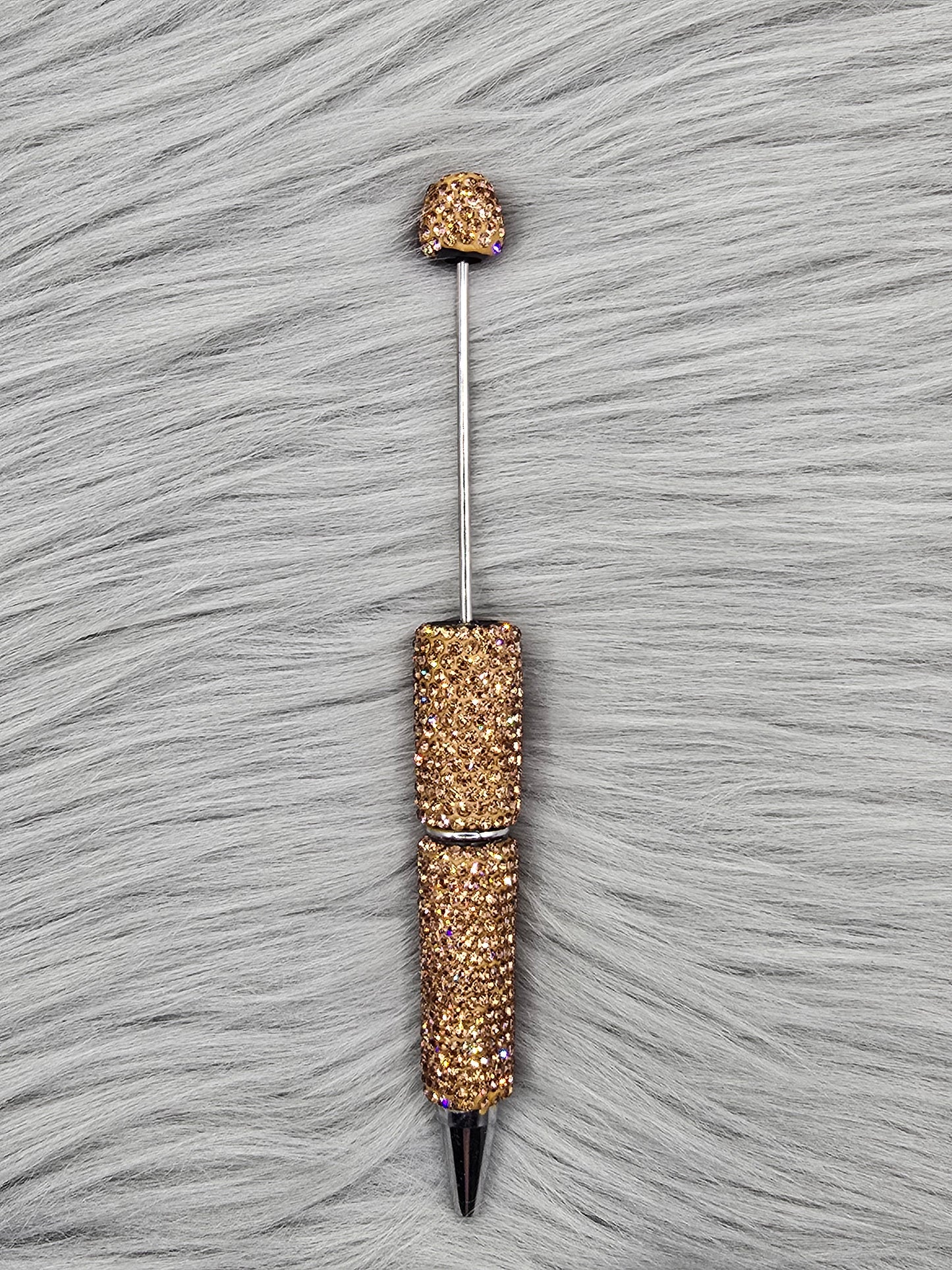 Light Brown Clay Rhinestone Beadable Pen on a gray fur background