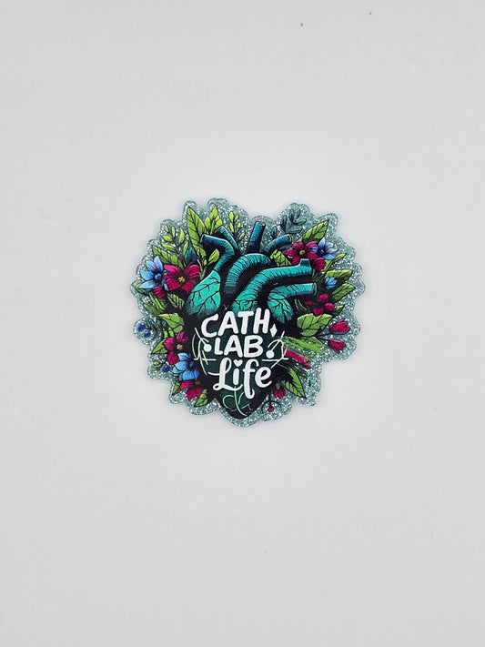 A green heart with flower and leaves around it and in the middle it states "cath lab life" on a glitter background