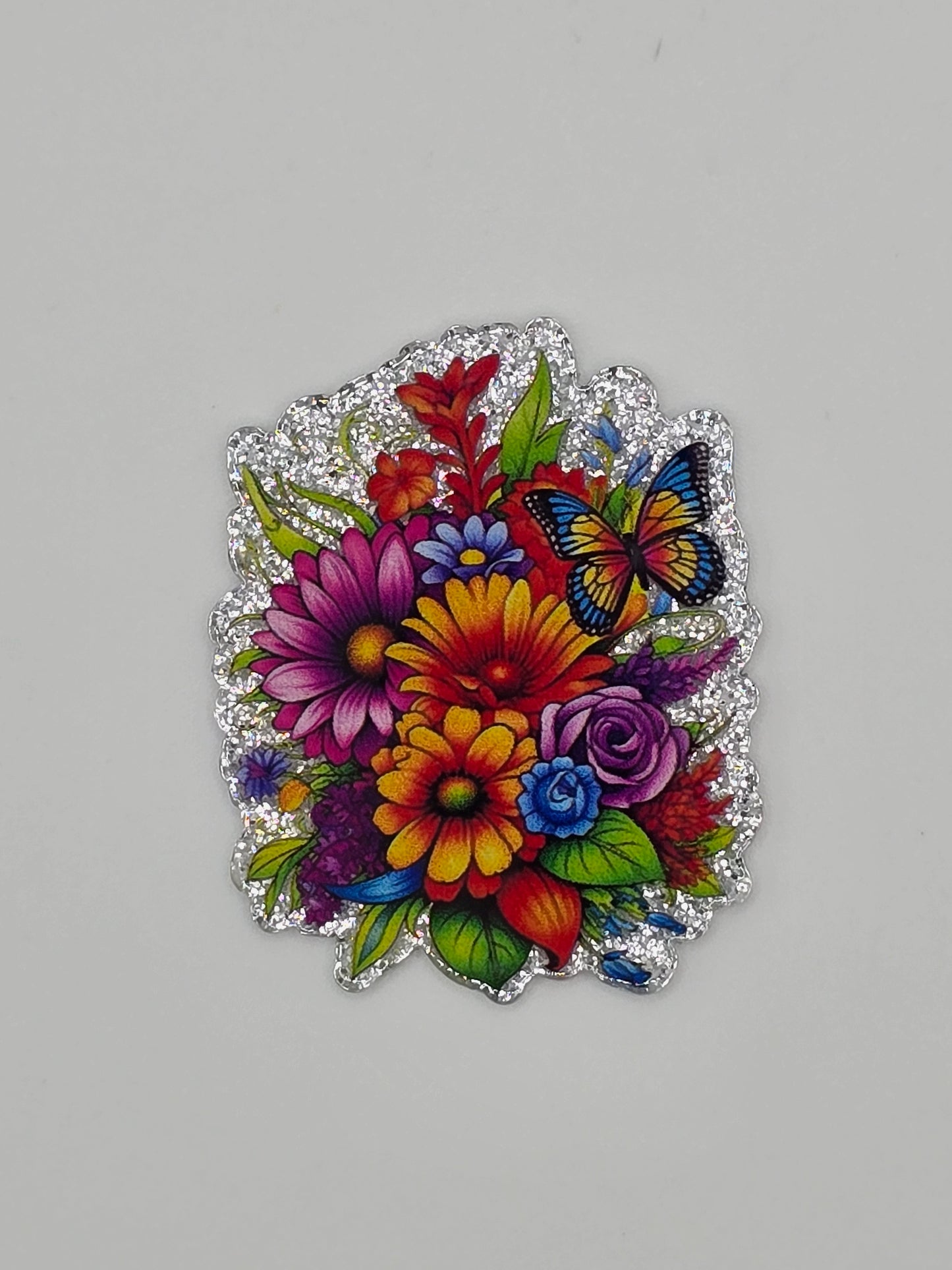 Colorful floral design with butterflies on a acrylic flatback gray background