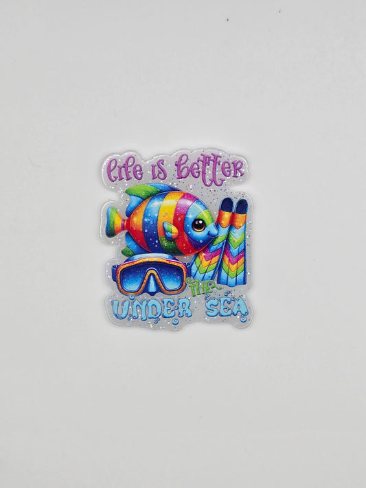 Colorful fish design with Life Is Better Under The Sea on a white glitter background flatback