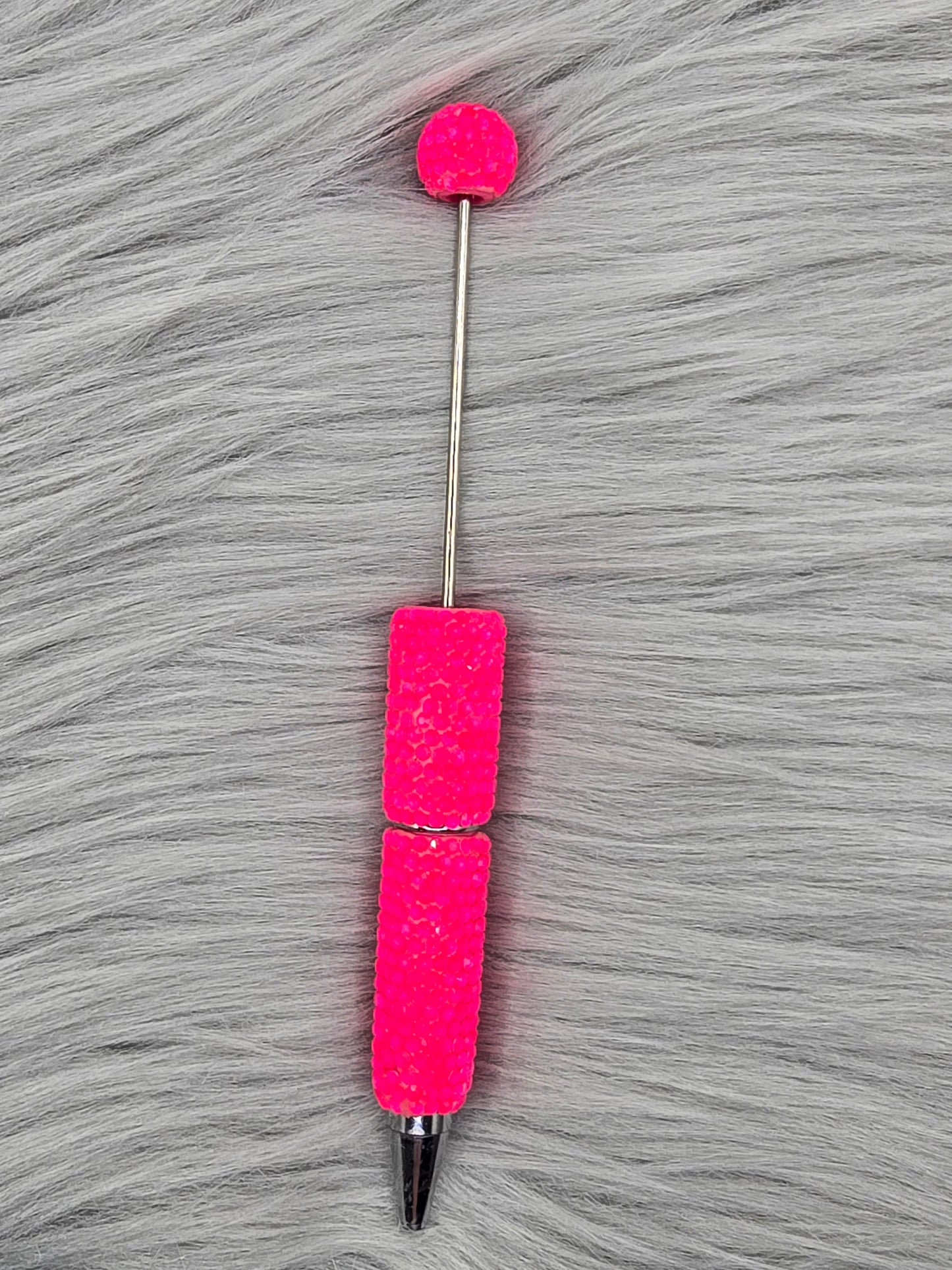 Neon Pink beadable pen on gray fur background