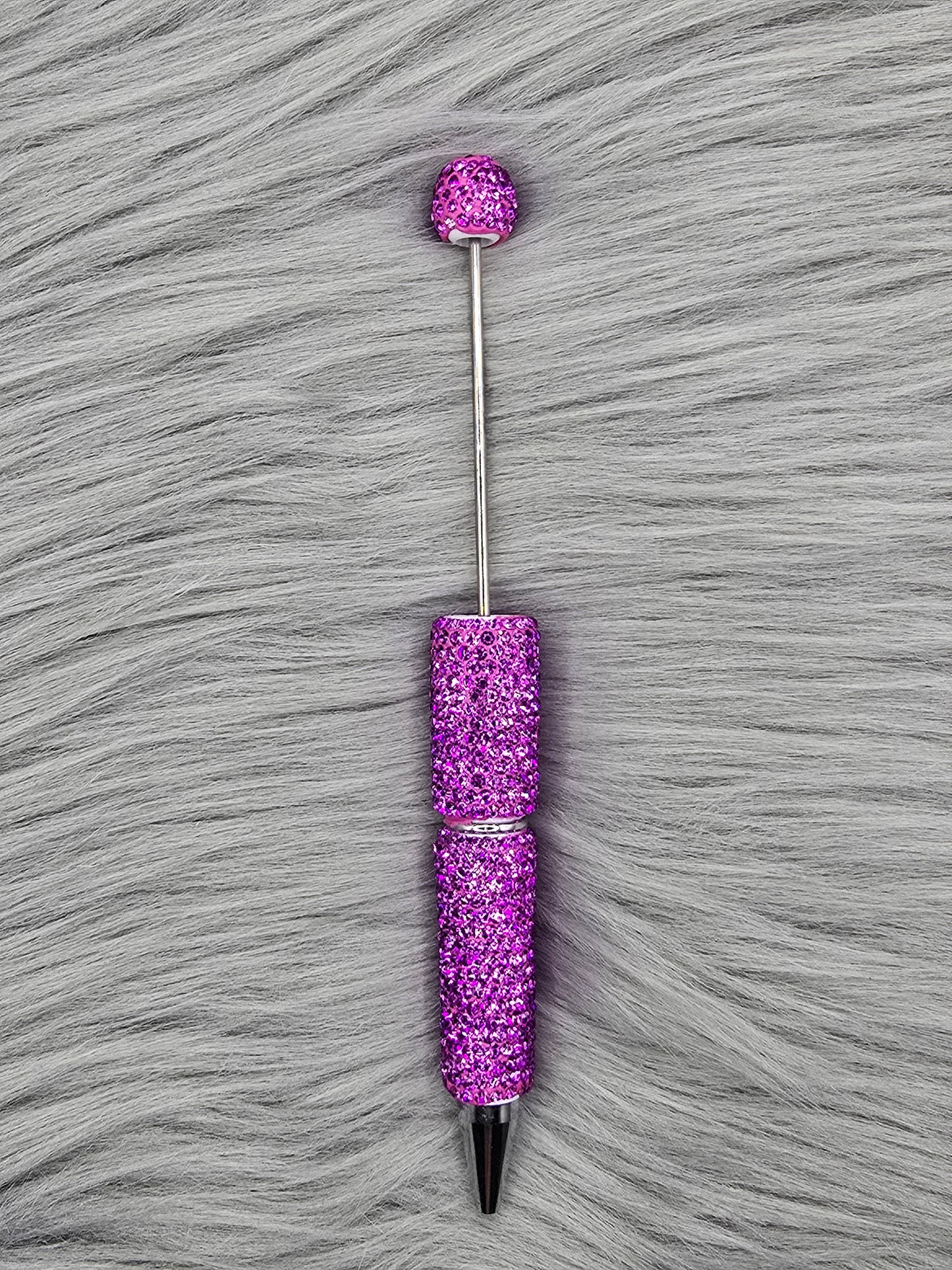 Purple Clay Rhinestone Beadable Pen on a gray fur background