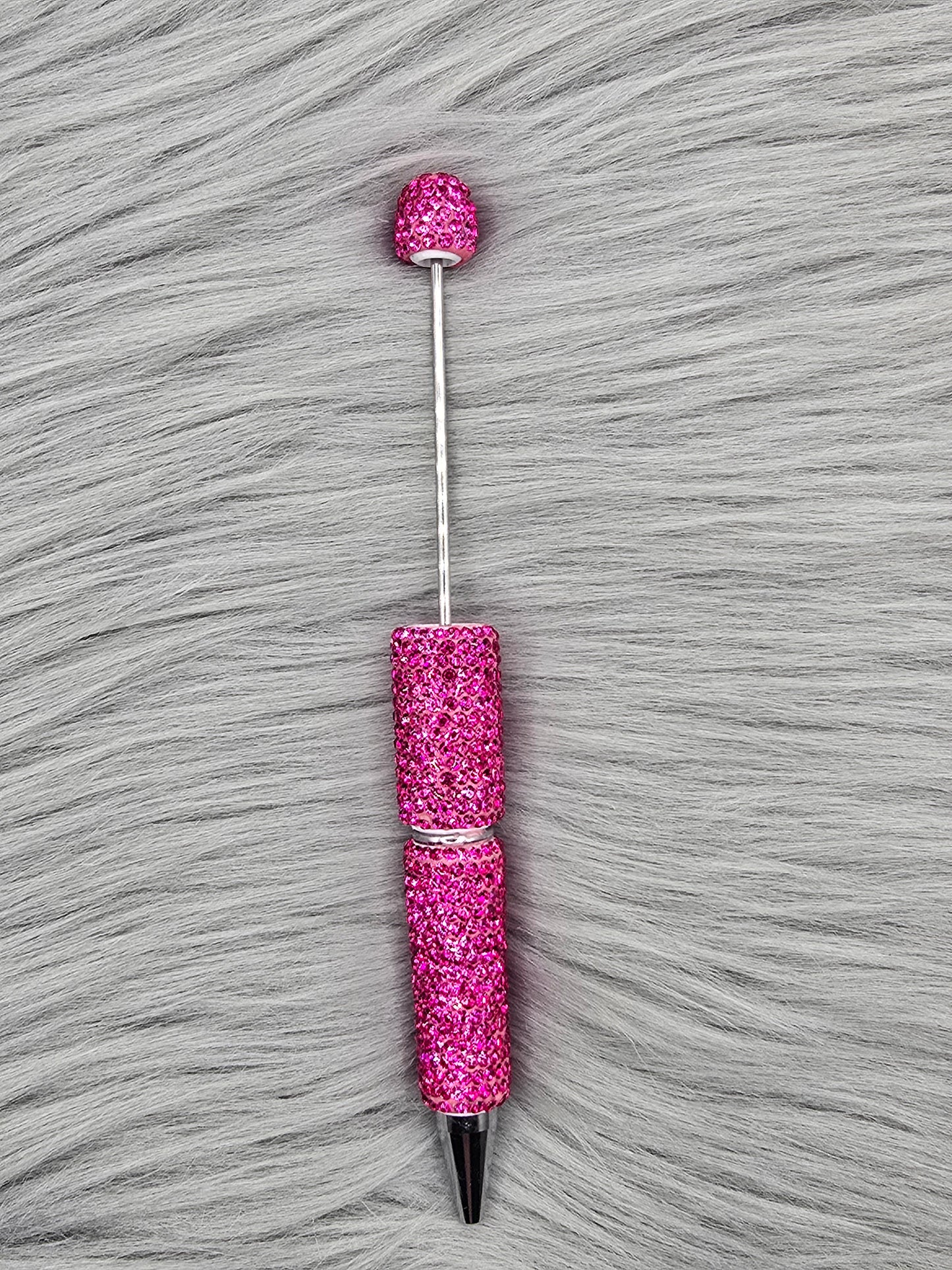 Pink Clay Rhinestone Beadable Pen on a gray fur background