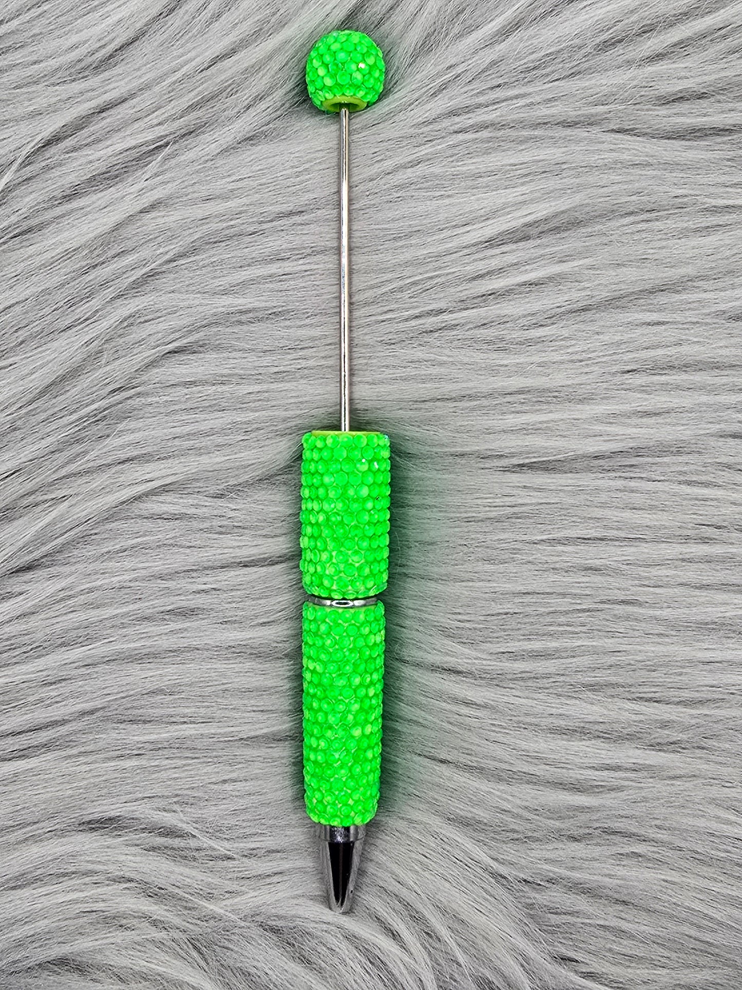 Neon Green beadable pen on gray fur background