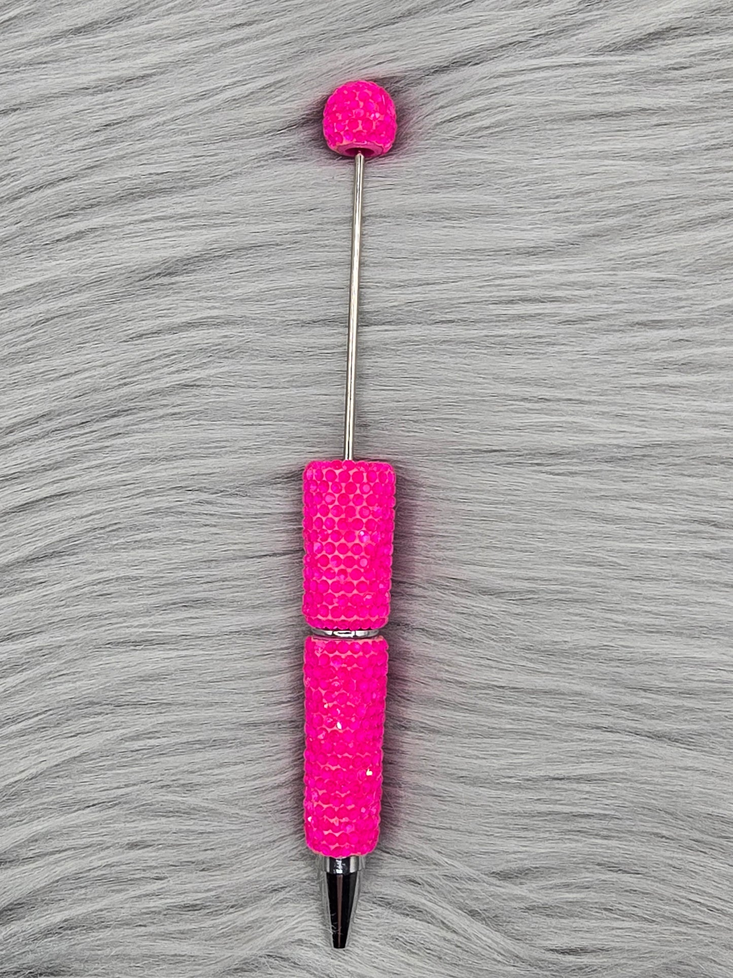 Neon Pink beadable pen on gray fur background