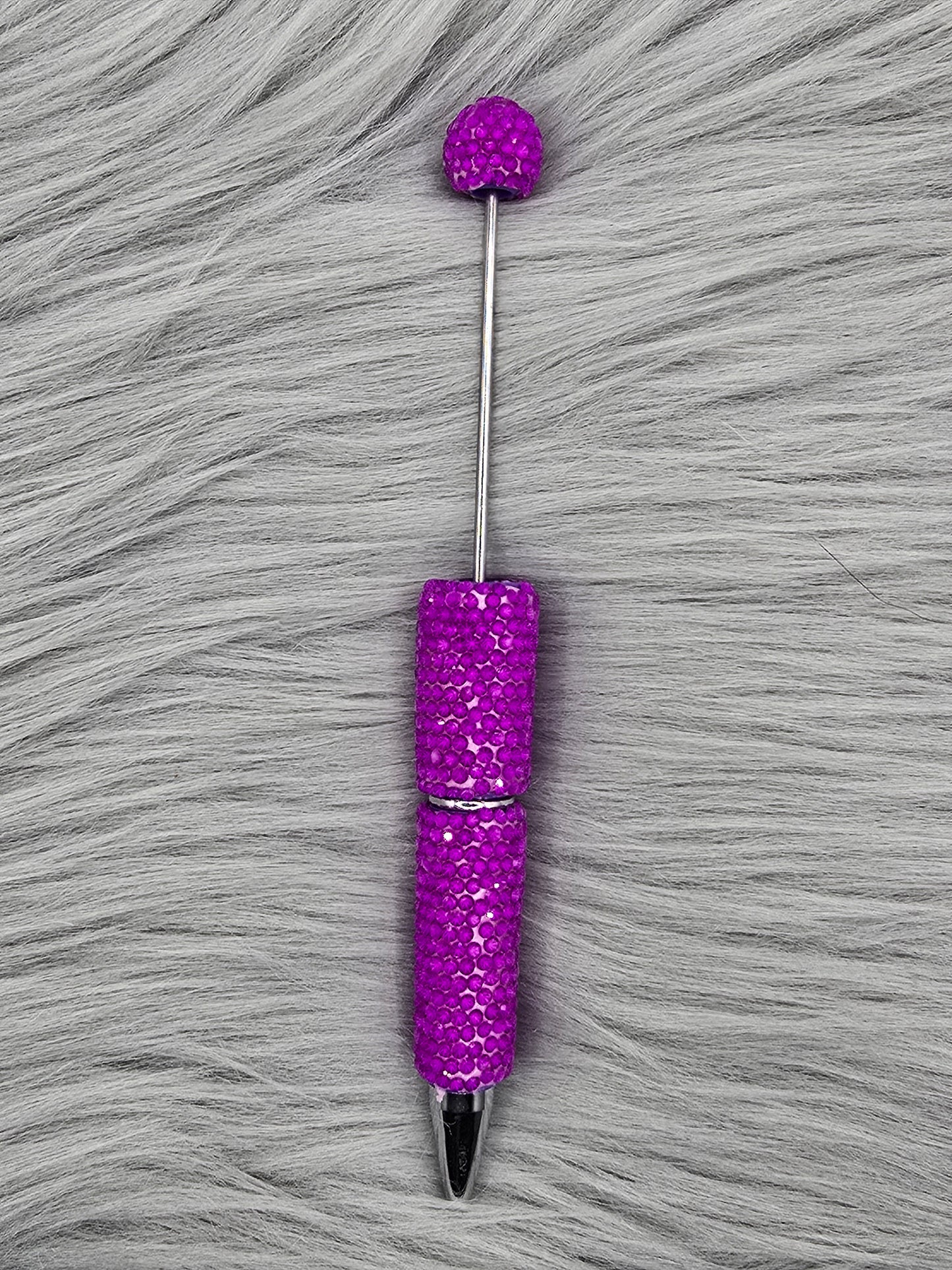 Neon Purple beadable pen on gray fur background