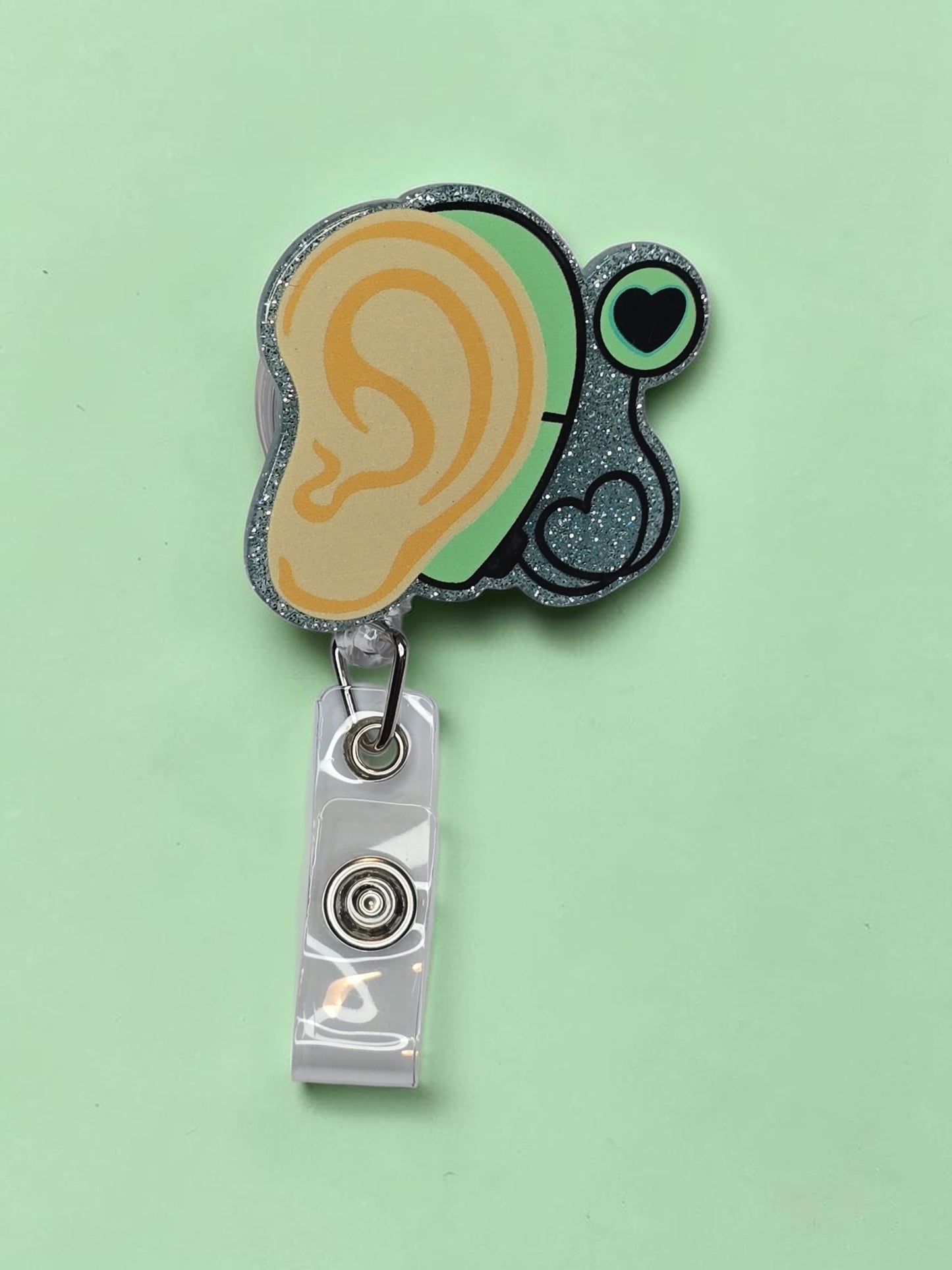 Ear with Hearing Aid Badge Reel
