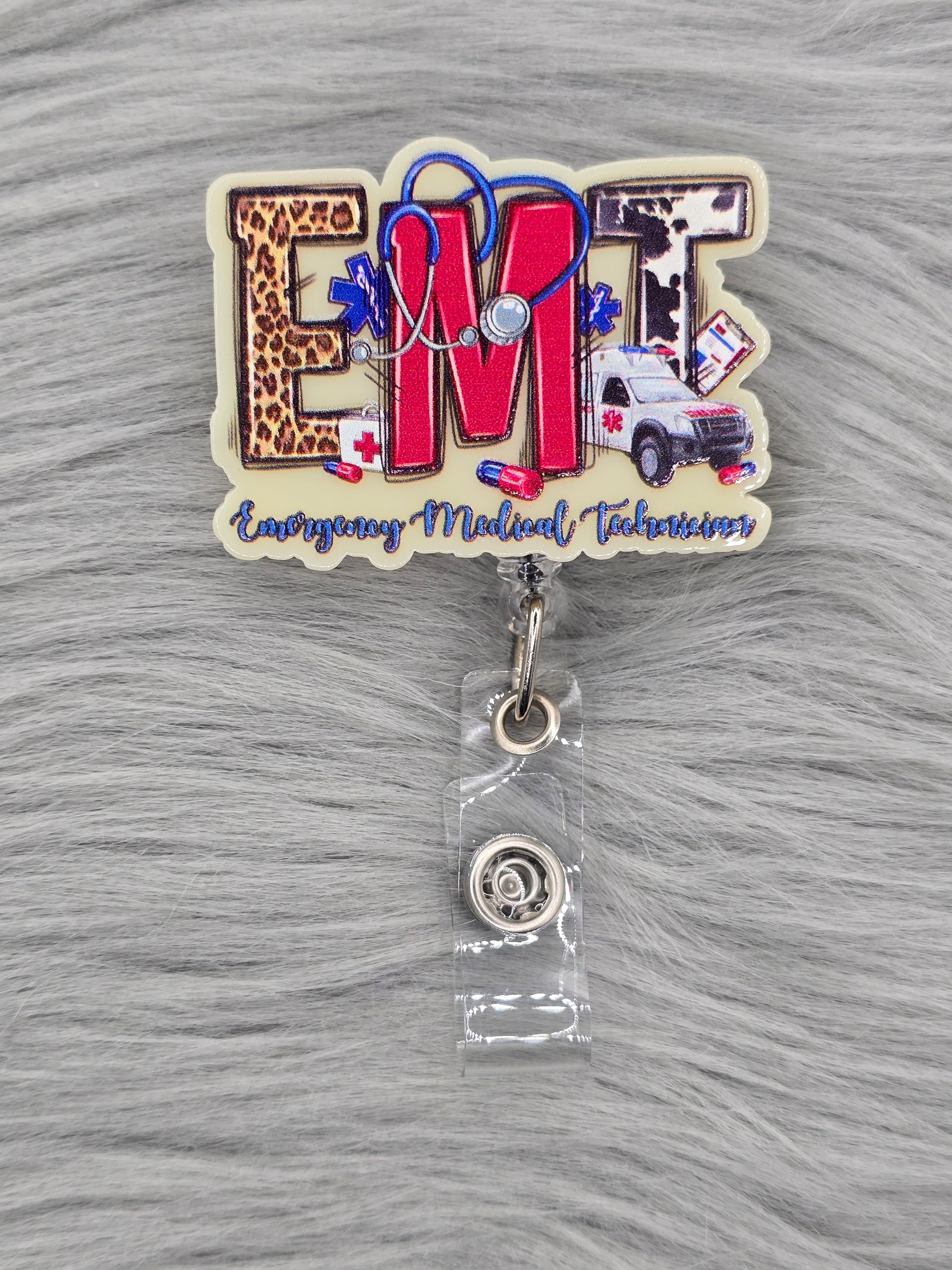Medical-themed acrylic flatback with 'Emergency Medical Technician' text on the bottom and EMT in the middle on a light yellow background