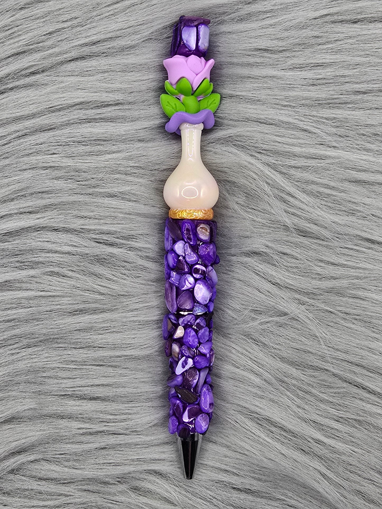 Beadable purple pen with purple pebbles and a white vase focal with a purple flower at the top
