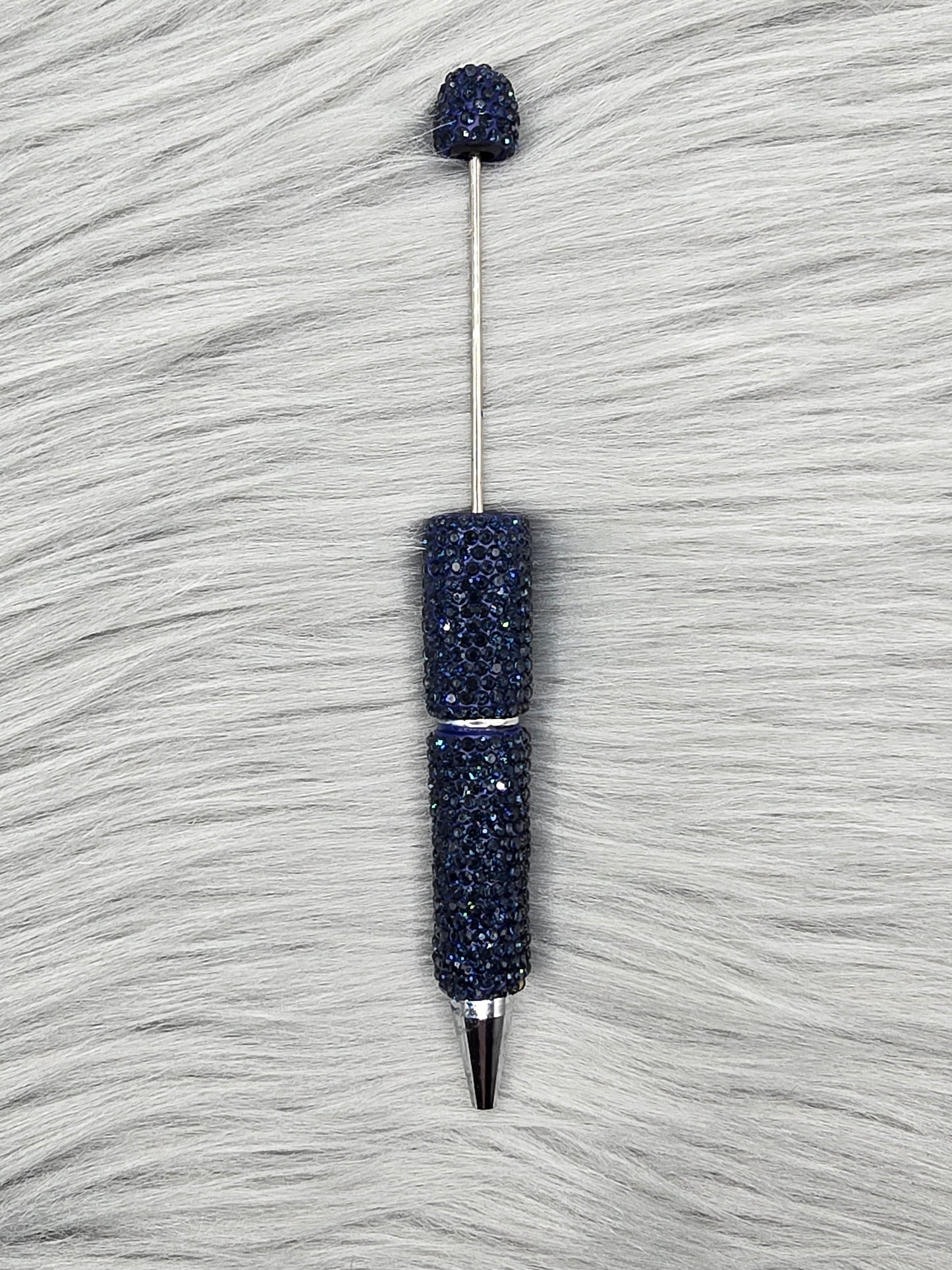 Navy Clay Rhinestone Beadable Pen on a gray fur background
