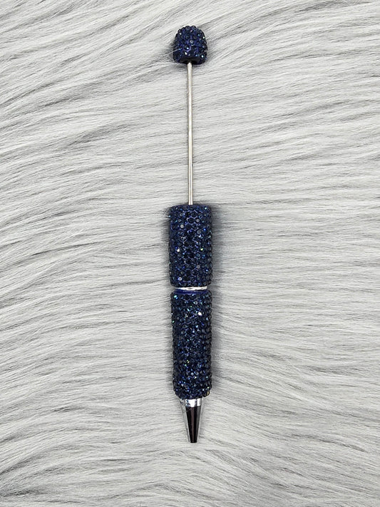 Navy Clay Rhinestone Beadable Pen on a gray fur background
