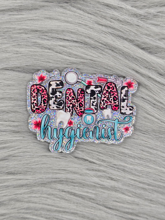 Glitter silver acrylic flatback with the word Dental in animal print and  the word hygienist in light green with dental pictures